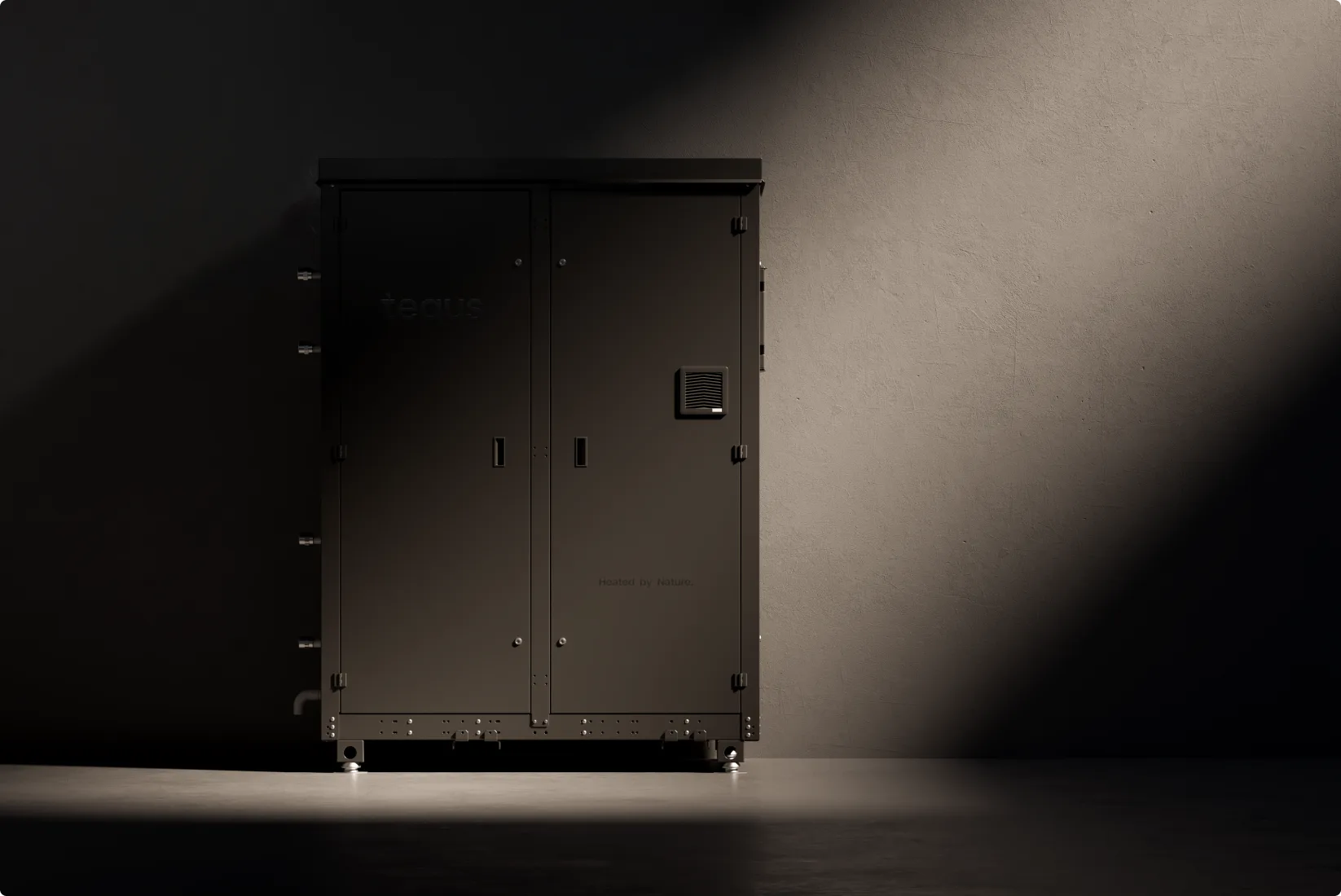 Dark metallic server cabinet against gray wall